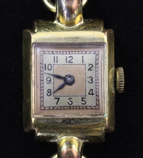 A 1940s ladys gold plated and steel manual wind wrist watch on an Italian textured 18ct gold bracelet,